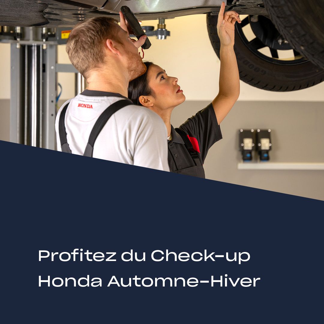 Techniciens Honda effectuant le Check-up Automne-Hiver au Garage Majestic SA à La Tour-de-Trême, spécialiste entretien Honda.